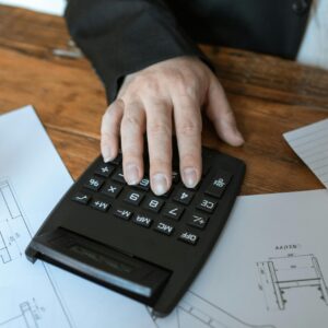 A Close-Up Shot of a Person Using a Calculator